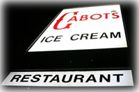 Cabot's exterior sign by night